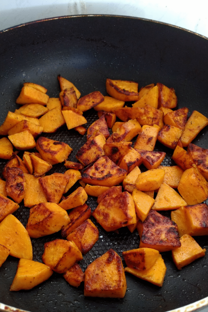 sweet potato cooking on a frying pan